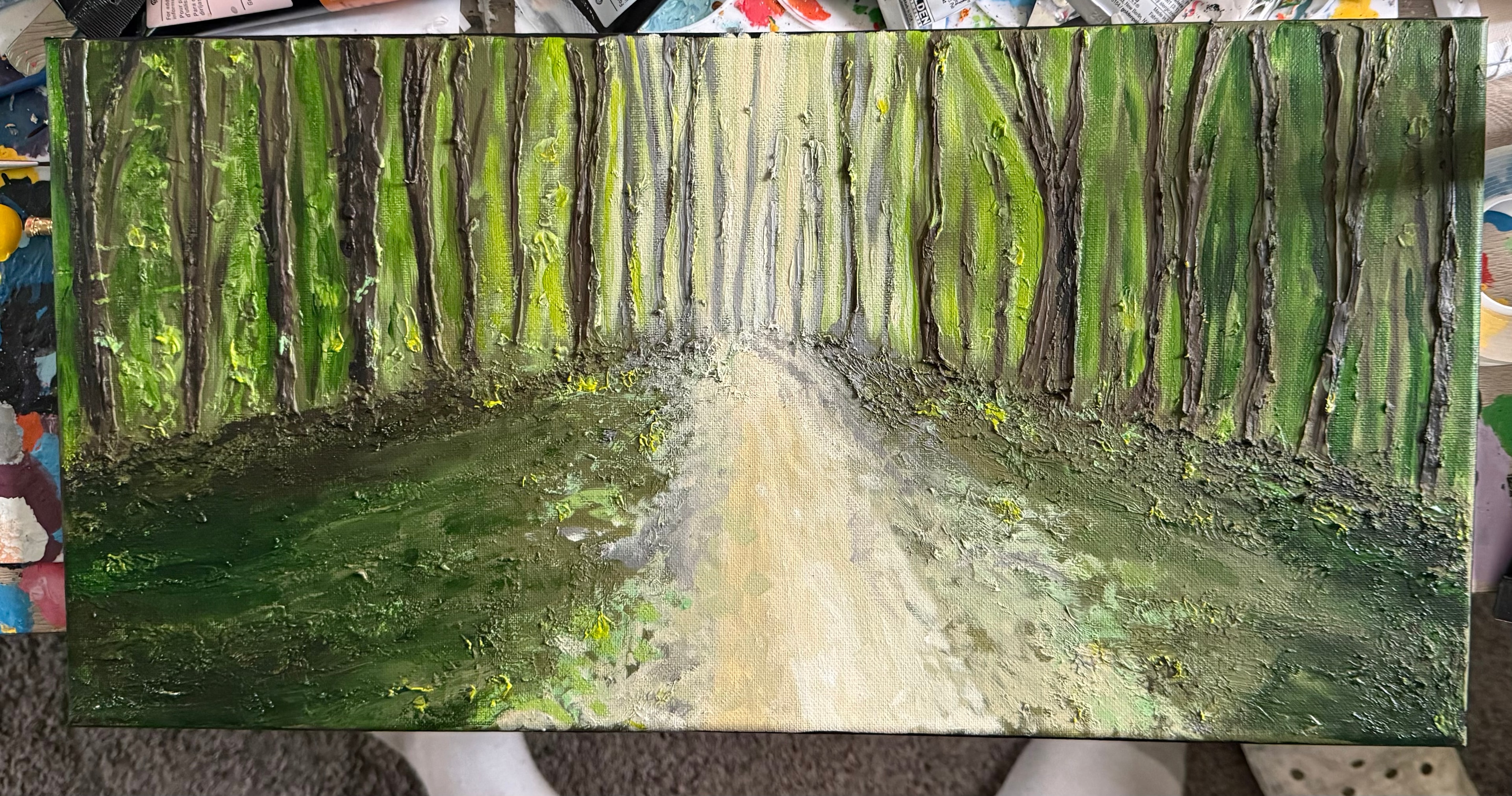 Green Forest Pathway — original 8x10 inch caulk texture landscape painting by Jay the Painter, Akron Ohio. Tall dark tree trunks lining a glowing cream pathway through lush green forest, massive raised caulk texture technique. SOLD.