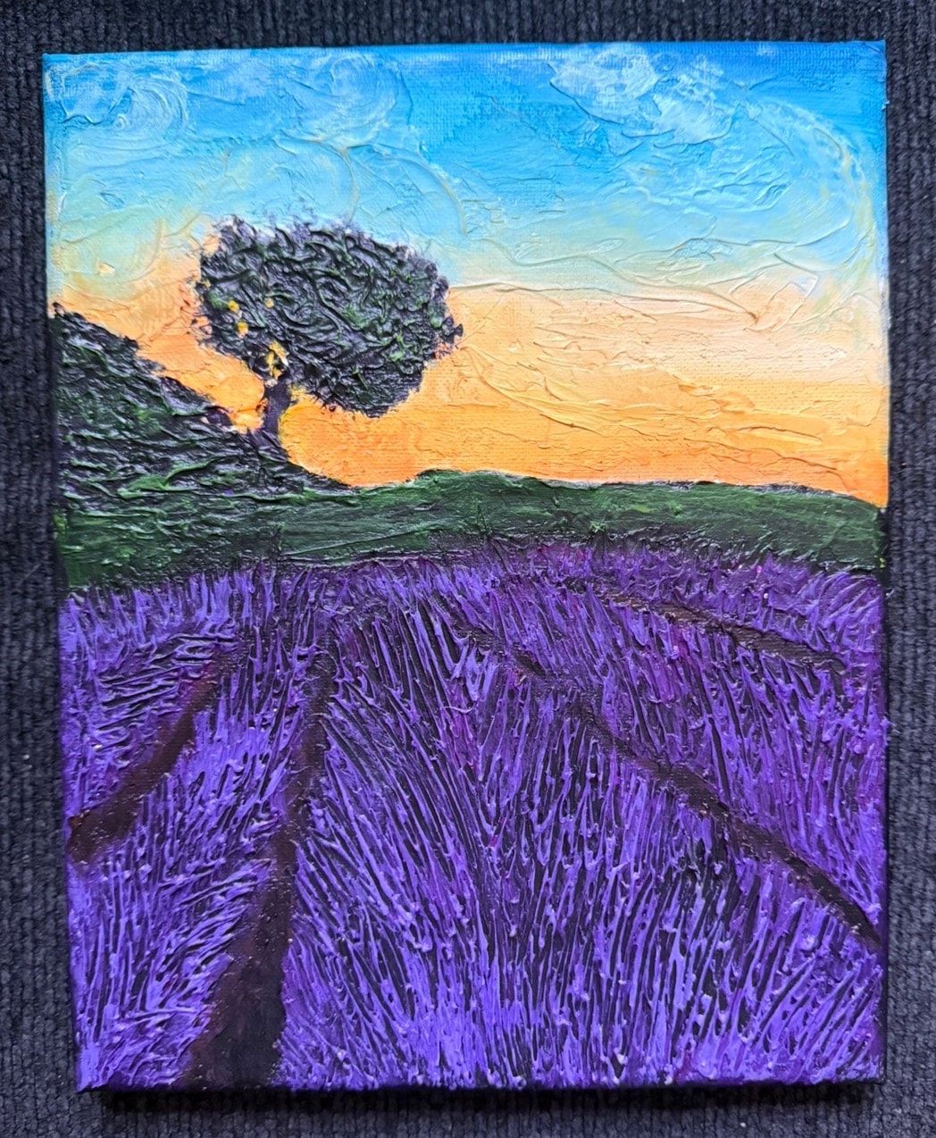 Lavender Field at Golden Hour — original 8x10 inch caulk art painting by Jay the Painter, Akron Ohio. Thousands of individual lavender stalks in heavy 3D caulk texture beneath blazing orange and blue sunset sky with solitary tree silhouette.