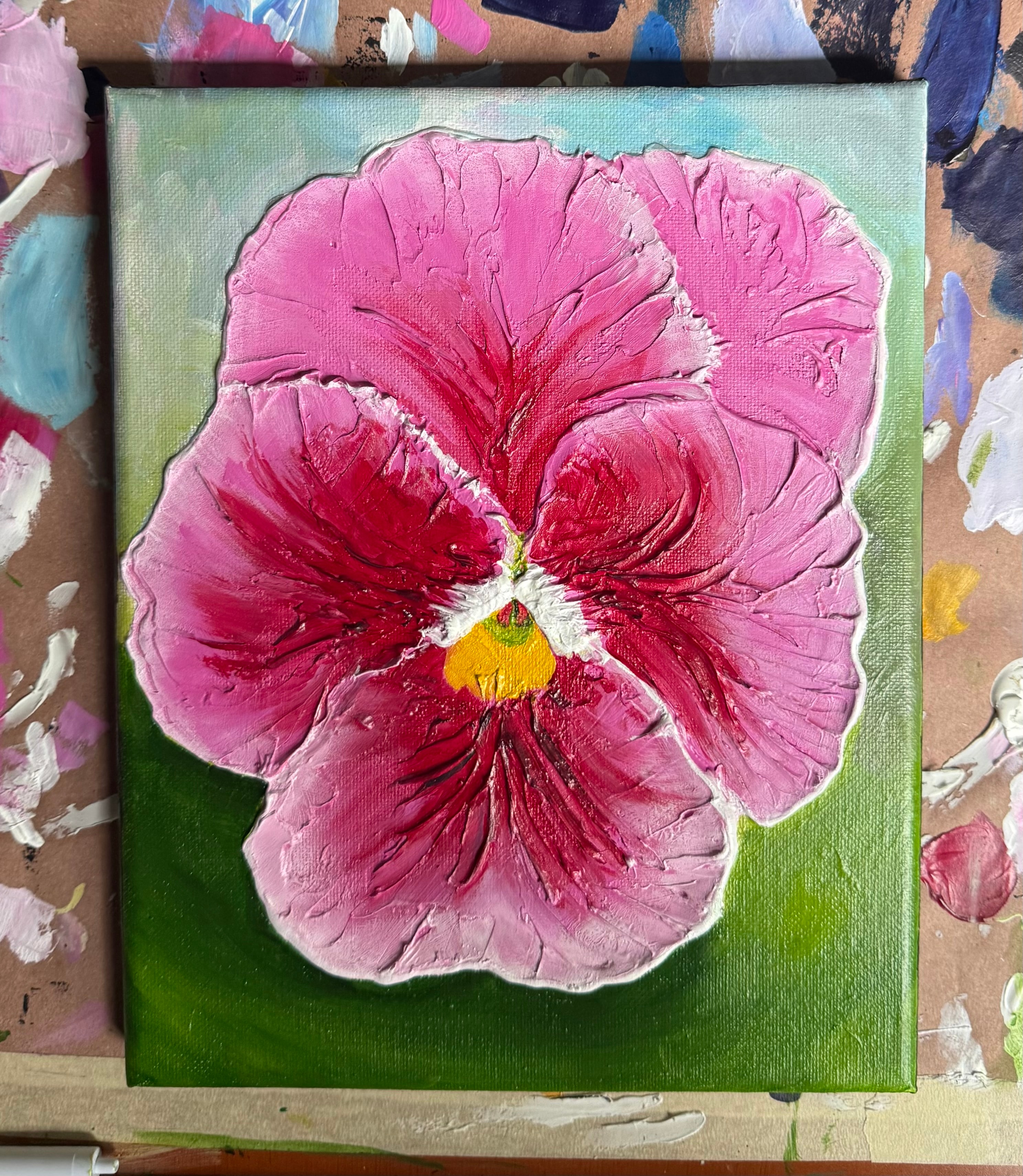 Pink Pansy — original 8x10 acrylic painting by Jay the Painter, Akron Ohio. Deep magenta and rose pansy petals with yellow center on bold green background, caulk texture.