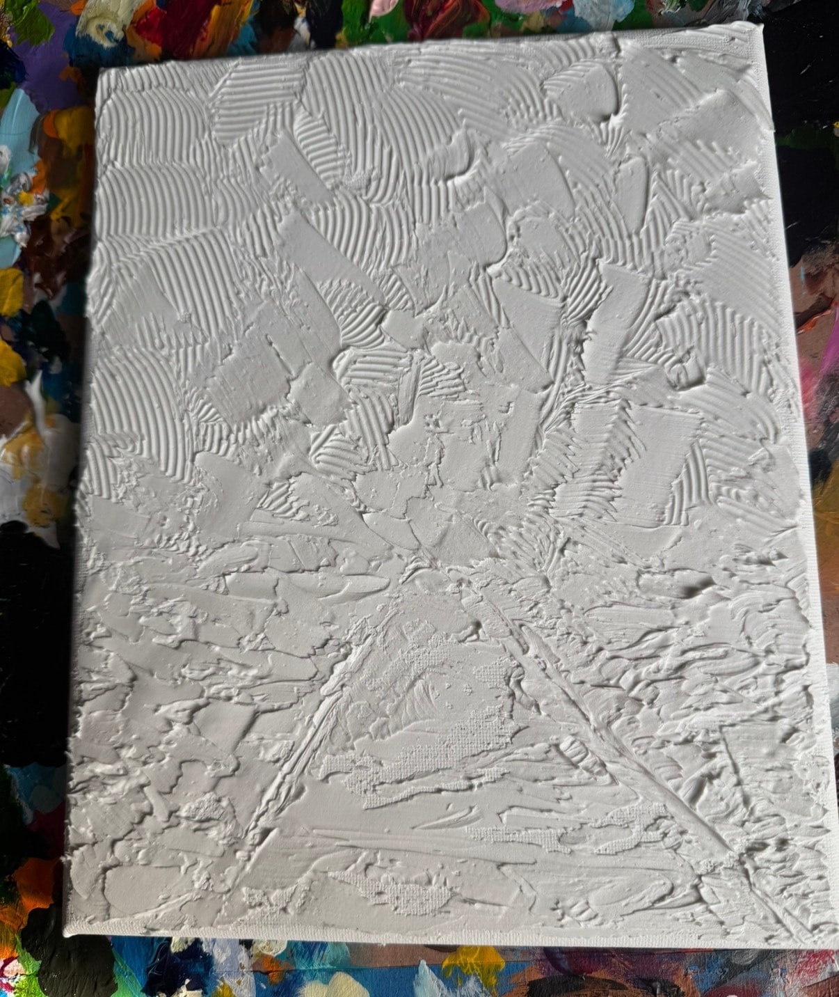 Blue Forest Path stage 1 — first caulk layer on canvas, beginning to define the forest composition