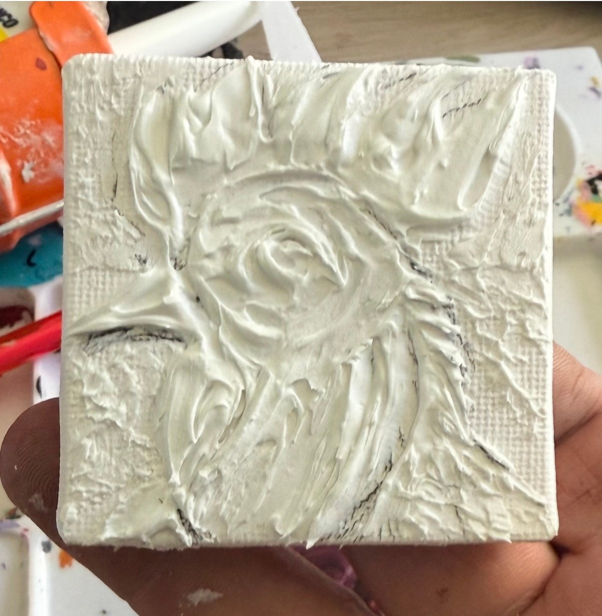 Caulk texture applied to canvas before painting — Jay the Painter process